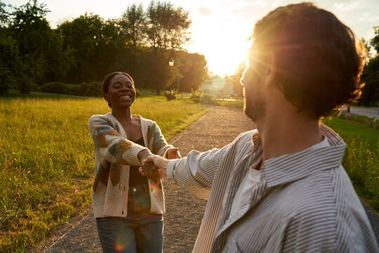 Couple enjoys time together in a park during sunset