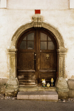 Stone arch door with garden gnomes