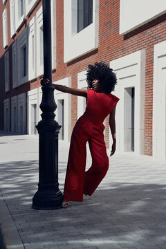 Fashion portrait of woman posing in modern city street