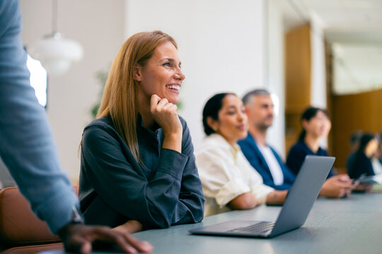 Smiling Businesswoman in Office Meeting