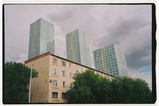 Modern residential towers above older apartment buildings