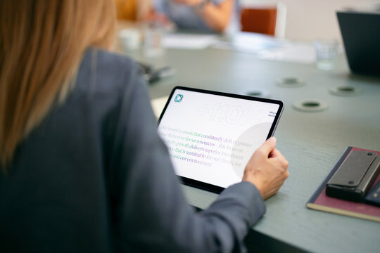 Business Meeting Presentation on Tablet in Conference Room