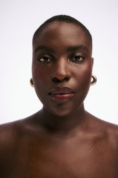 Portrait of a Person With Short Hair and Earrings