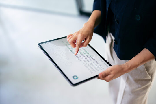 Professional Using Tablet Touchscreen for Business Presentation