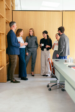 Colleagues Chatting During Casual Office Coffee Break