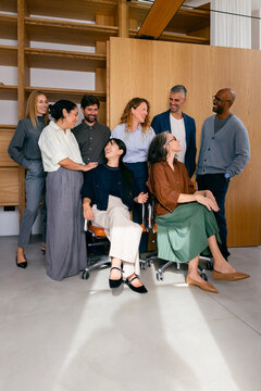Team of Business People Smiling Together During Casual Meeting