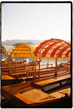 Pletna boats docked at lake Bled