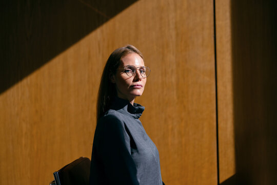 Businesswoman Portrait in Sunlit Wooden Interior