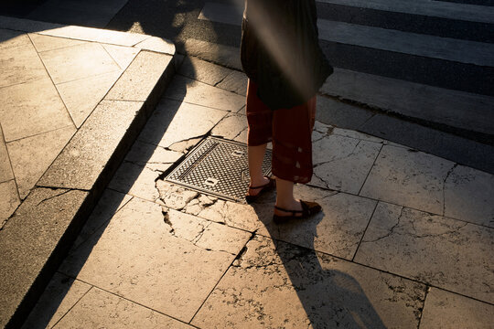 Walking on a Sunny Street With Shadows Seen in the Afternoon