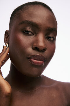 Model Poses for a Close-Up Shot in Studio Setting