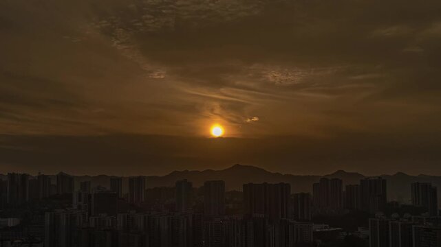 Golden Sunset Over City Skyline With Mountains