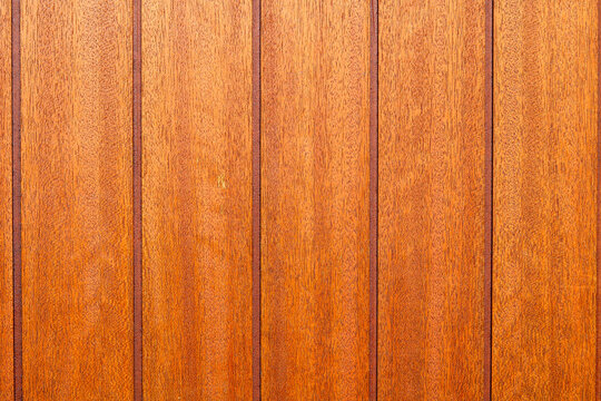 Polished teak wood deck texture with vertical dark caulking lines.