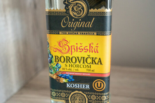 Warsaw, Poland - Sep 5, 2026: Close up of the Spisska Borovicka bottle label showing brand lettering and kosher certification mark