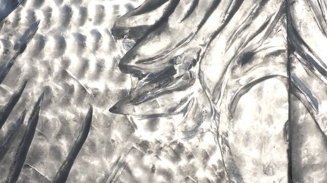 Glowing ice surface. A tranquil winter scene of a frozen lake at sunset. Sunlight touches the ice, refraction and reflection, creating swirl pattern