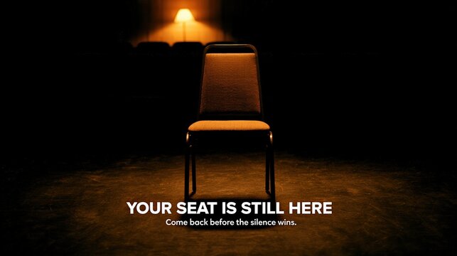 Empty chair in support group circle illuminated by warm lamp with sobriety invitation