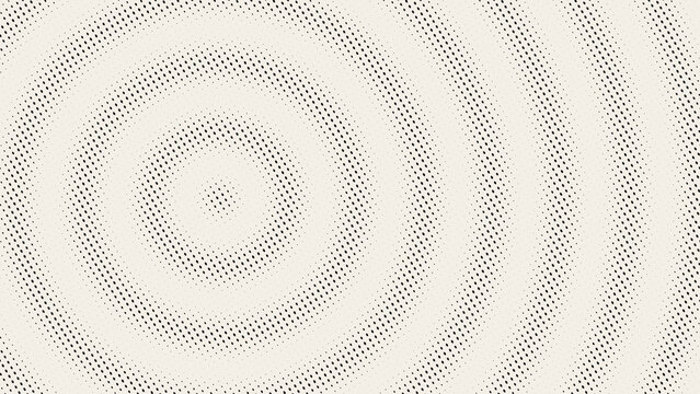 Black halftone dot pattern with concentric circular rings on a light background, featuring small circular shapes in a radial arrangement