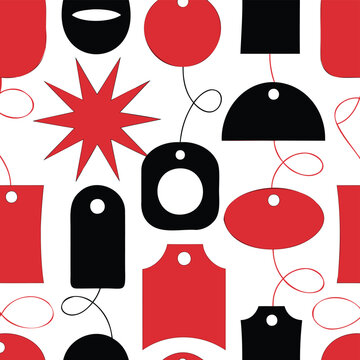 Gift tags with thin wavy strings create a playful black and red pattern over a white surface.