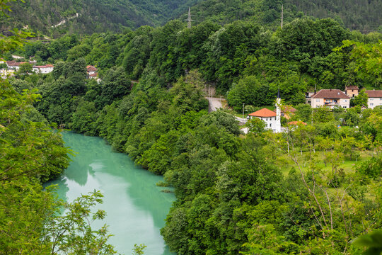 Turquoise River Winding Through Lush Forest Beside Small Village and Riverside Mosque in Valley, Jablanica, Bosnia And Herzegovina