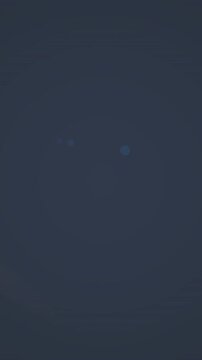 Digital animation of red spot of light against with copy space on blue background