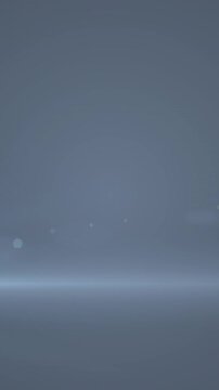 Digital animation of blue spot of light against with copy space on grey background