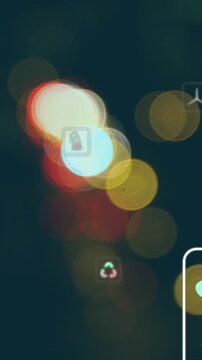 Animation of multiple icon in squares over blurred lights of moving vehicles on street in city