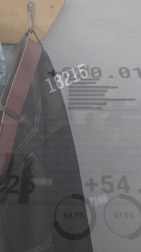 Animation of changing numbers, graphs, trading board, cloth hanged on hook in house