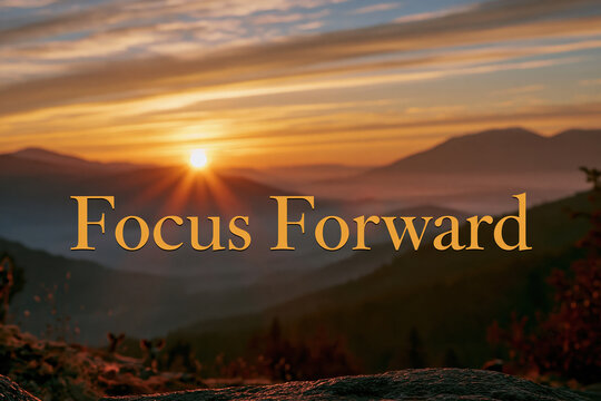 Text "Focus Forward", Endless Dawn, elegant gold foil typography catching the first rays of a vibrant golden sunrise over a soft, misty mountain horizon backdrop