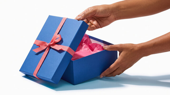 Blue gift box being opened with pink ribbon and tissue paper inside  