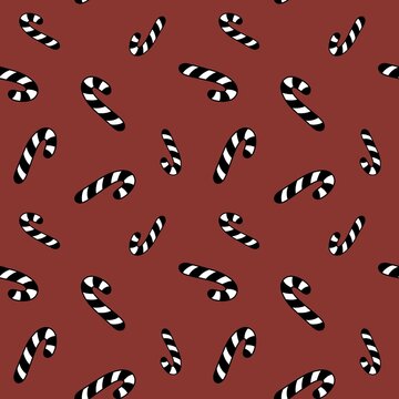 Black and white candy canes on red background seamless pattern