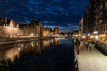Fototapeta premium Night view of Gdansk Old Town waterfront embankment on Motlawa river in Poland.