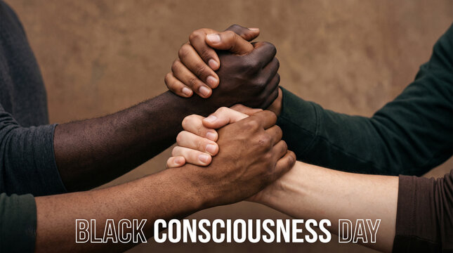 Diverse people holding hands together in a symbol of unity and racial equality