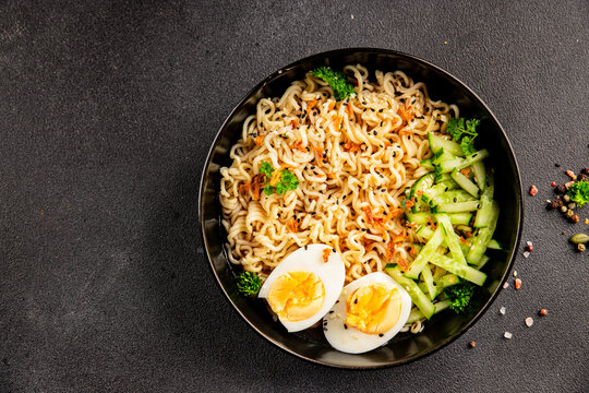 Noodle bowl no meat broth, egg, vegetables vegetarian dish delicious appetizer fresh and delicious gourmet food background on the table traditional rustic food top view copy space