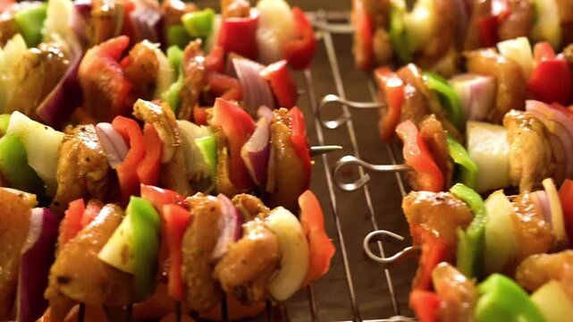 Fresh raw chicken kebabs with colorful bell peppers