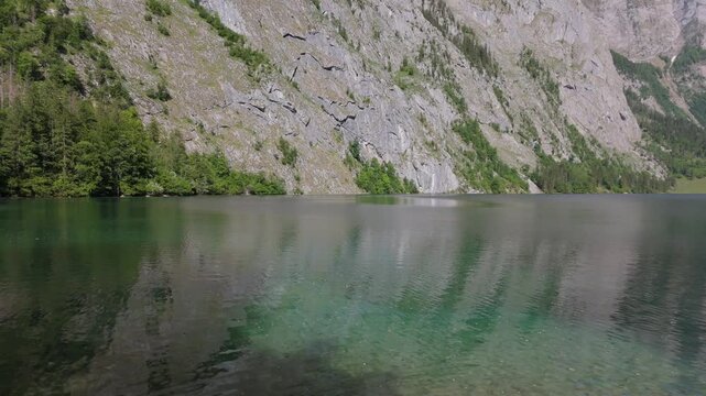 Obersee Clear Water and Cliff Low Aerial Berchtesgaden Germany