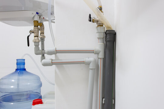 A water supply system consisting of a pipe distribution system with bends and taps that supplies water to the heating boiler.