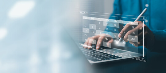 Digital project planning concept showing a professional using a laptop with Gantt chart, timeline,...