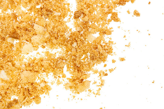 Close-up of golden toast pieces scattered in a textured pile, isolated on a transparent background with small crumb particles around the edges.