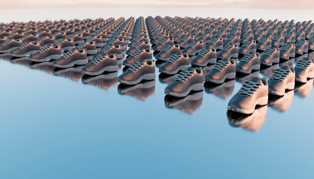 Rows of running shoes on reflective surface creating pattern