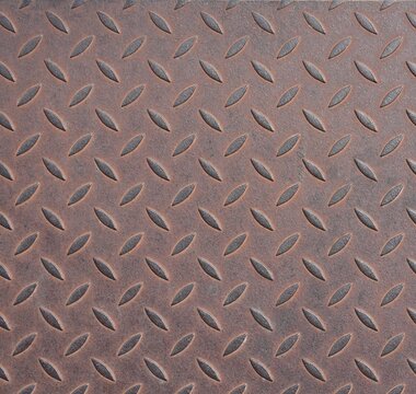 Rusty diamond plate steel texture with industrial metal pattern