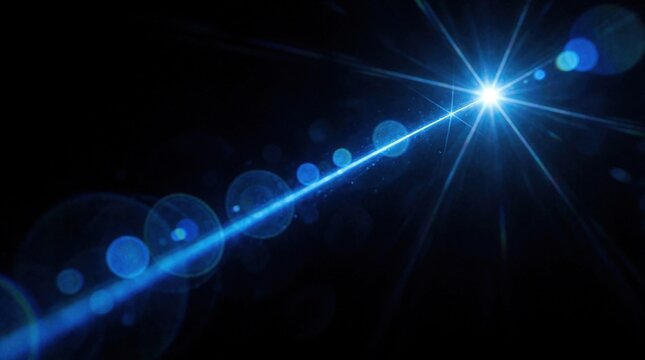 Bright blue light ray shoots from center point creating abstract starburst effect and lens flares in darkness. Energetic glowing digital art.