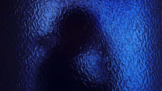 Blurred female figure seen through textured glass, moody blue atmosphere expressing sadness and isolation, 4K