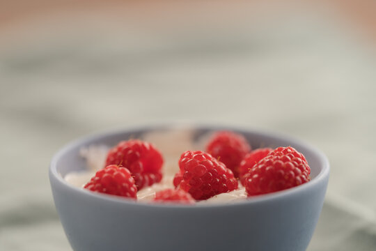 raspberries with yogurt in a bowl