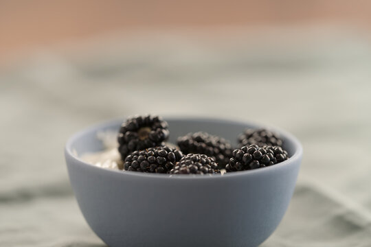blackberries with yogurt in a bowl