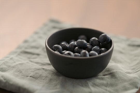 blueberries in a black ceramic bowl
