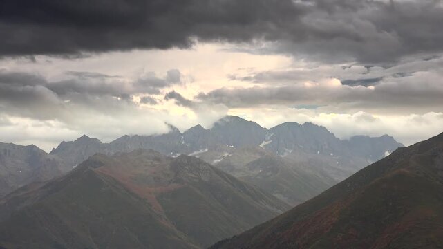 Kackar Mountain summit in Rize, Turkey rises above autumn valleys with rugged rocky ridges. Fall light and distant highland scenery create a dramatic seasonal panorama.