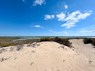 View from the hiking trail Sendero Punta del Boquerón across dunes and brackish land to the Caño de Sancti Petri between Chiclana de la Frontera, San Fernando and Cadiz, Andalusia, Spain © keBu.Medien