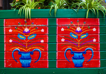 Polish folk floral motif on a green wooden fence, Krakow, Poland © Blazenka