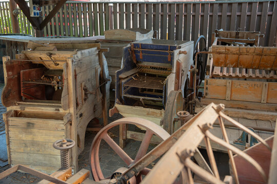 Close-up of a part of an old threshing machine outdoors.