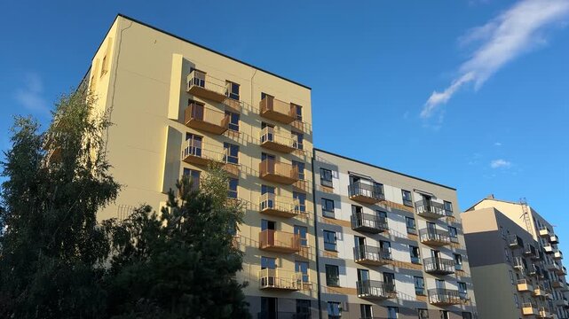 Facade building. Painting the facade of residential building. New facade block building before painting. Building Construction, renovation. Construction work at height, facade cleaning, plastering.