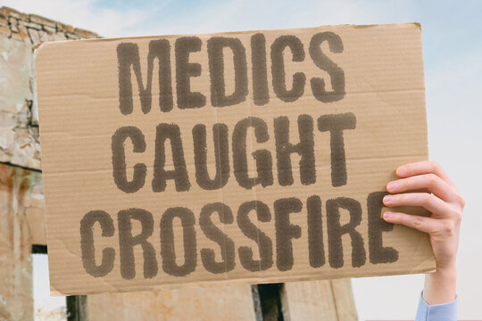 "Medics Caught Crossfire" Health professionals dying in combat between warring factions. CONFLICT. COLLATERAL. MEDICAL. CROSSFIRE. DEATH.